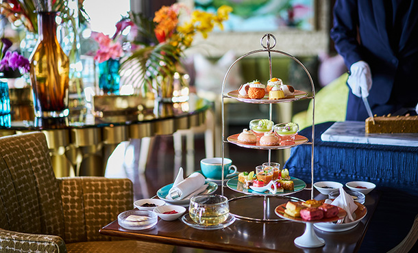 This is an image of sweets and tea service.